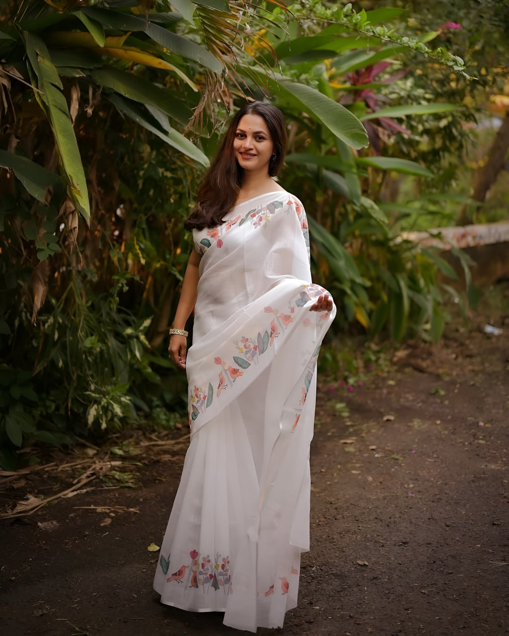 Elegant White Floral Printed Saree with Soft Pastel Border