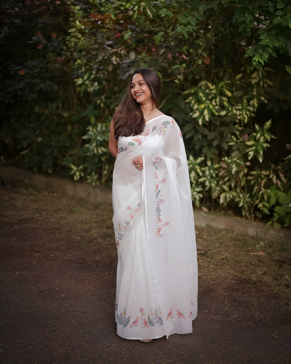 Elegant White Floral Printed Saree with Soft Pastel Border