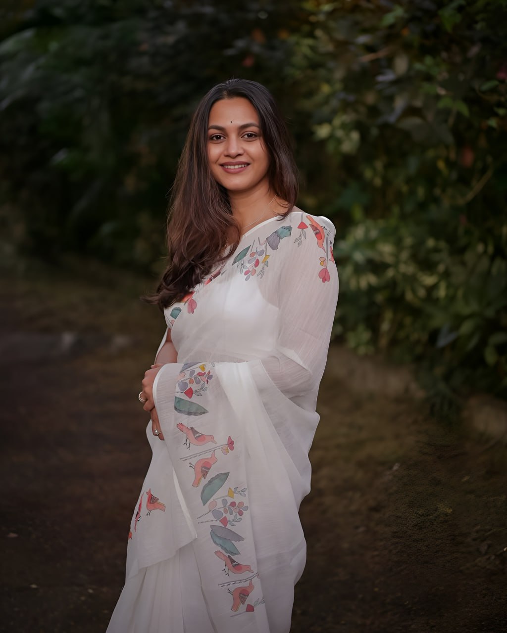 Elegant White Floral Printed Saree with Soft Pastel Border
