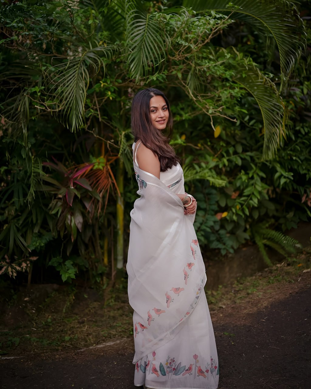 Elegant White Floral Printed Saree with Soft Pastel Border