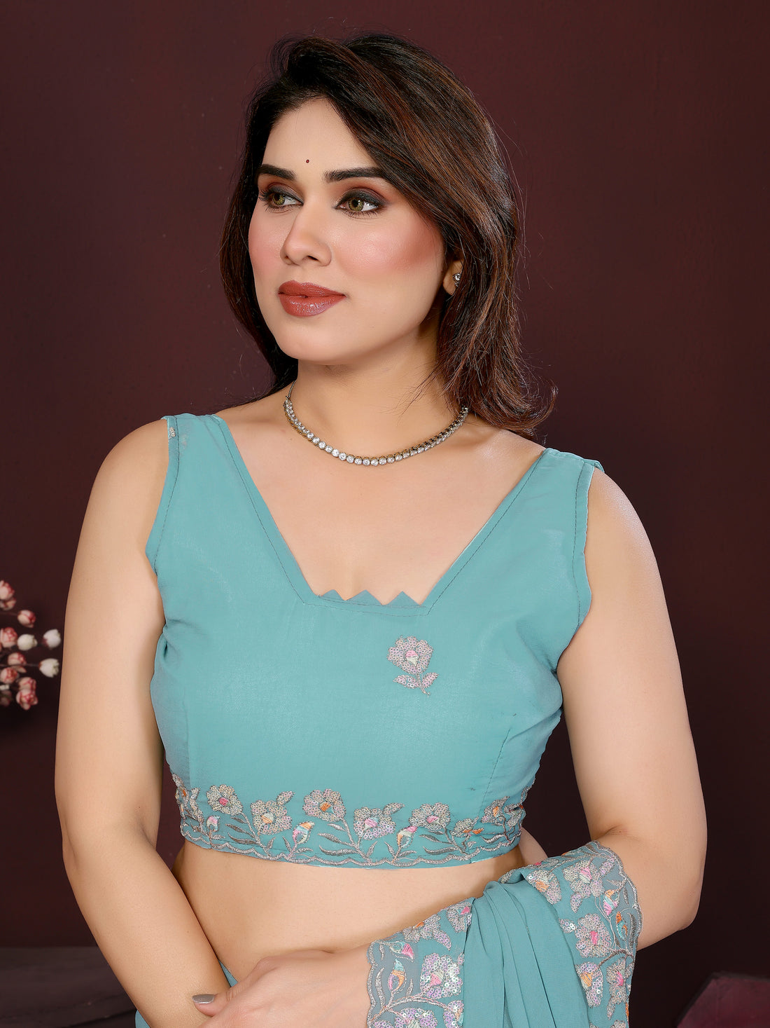 Turquoise Blue Georgette Silk Embroidered Saree with Floral Border & Unstitched Blouse