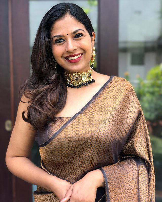 Black and Antique Gold Woven Silk Blend Saree with Tasselled Pallu