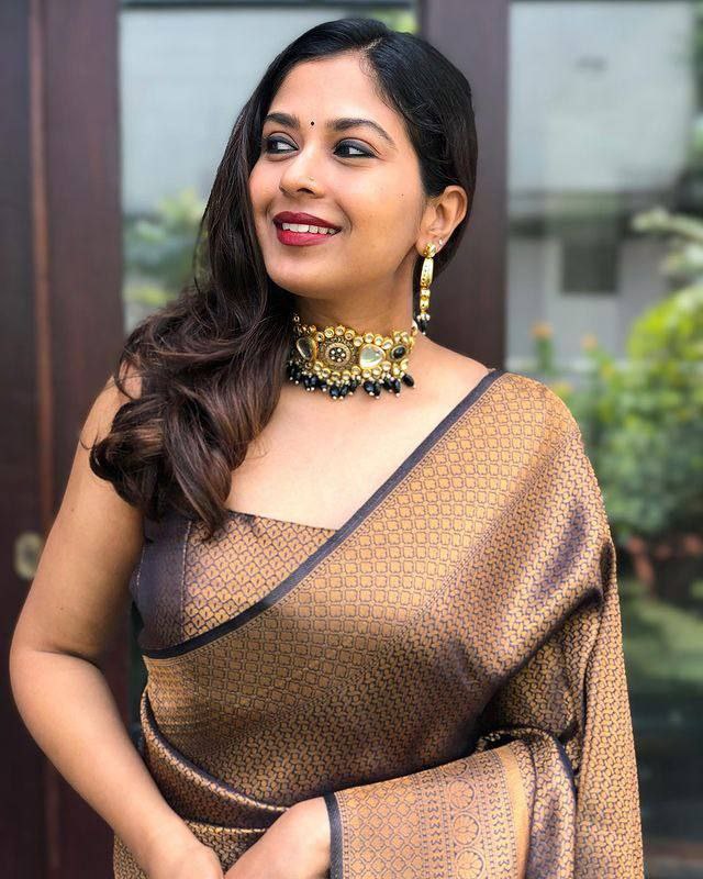 Black and Antique Gold Woven Silk Blend Saree with Tasselled Pallu