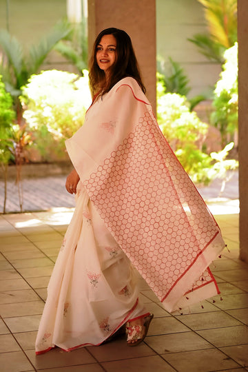 Elegant Cream Linen Cotton Saree with Minimal Floral Print & Red Contrast Border