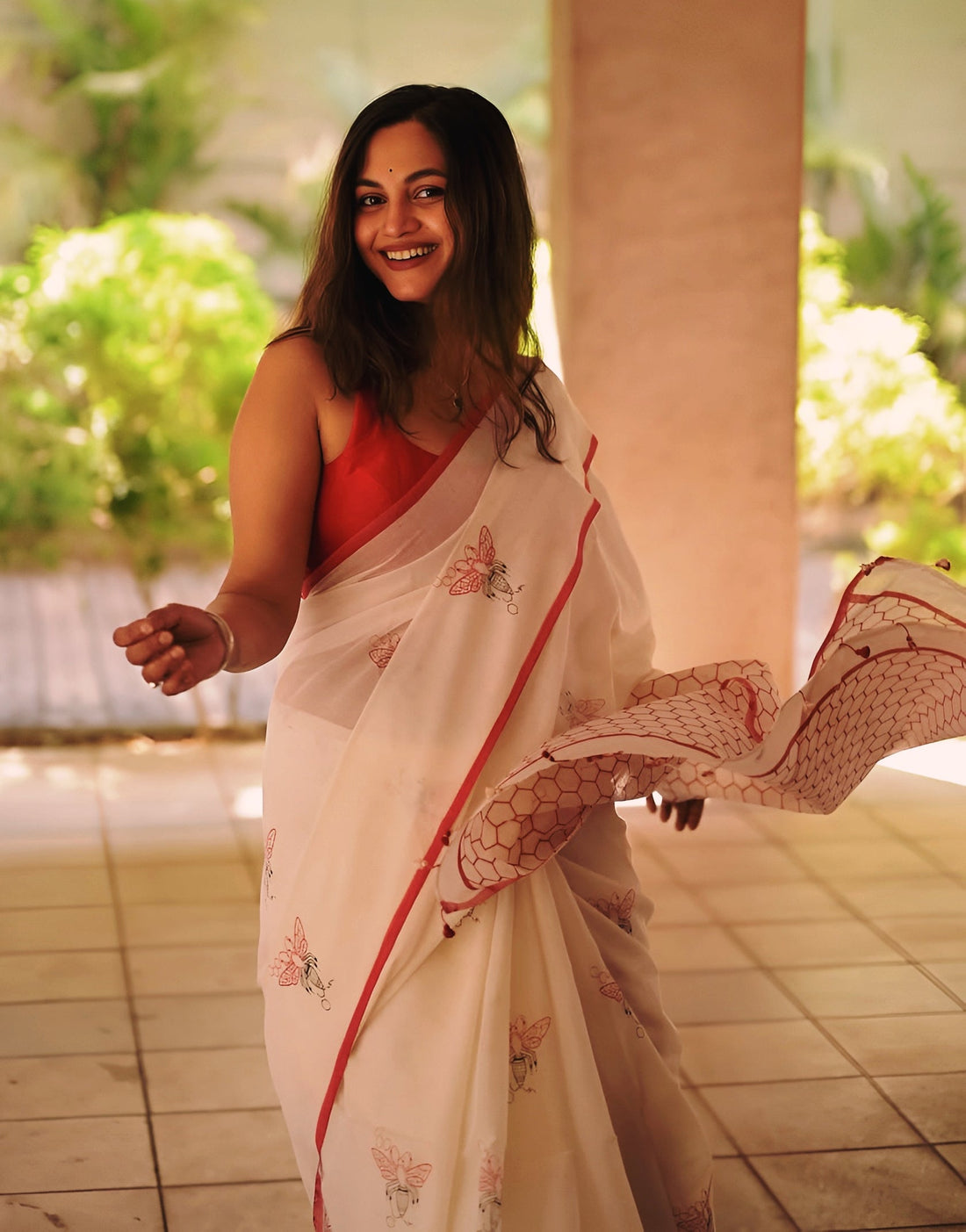 Elegant Cream Linen Cotton Saree with Minimal Floral Print & Red Contrast Border