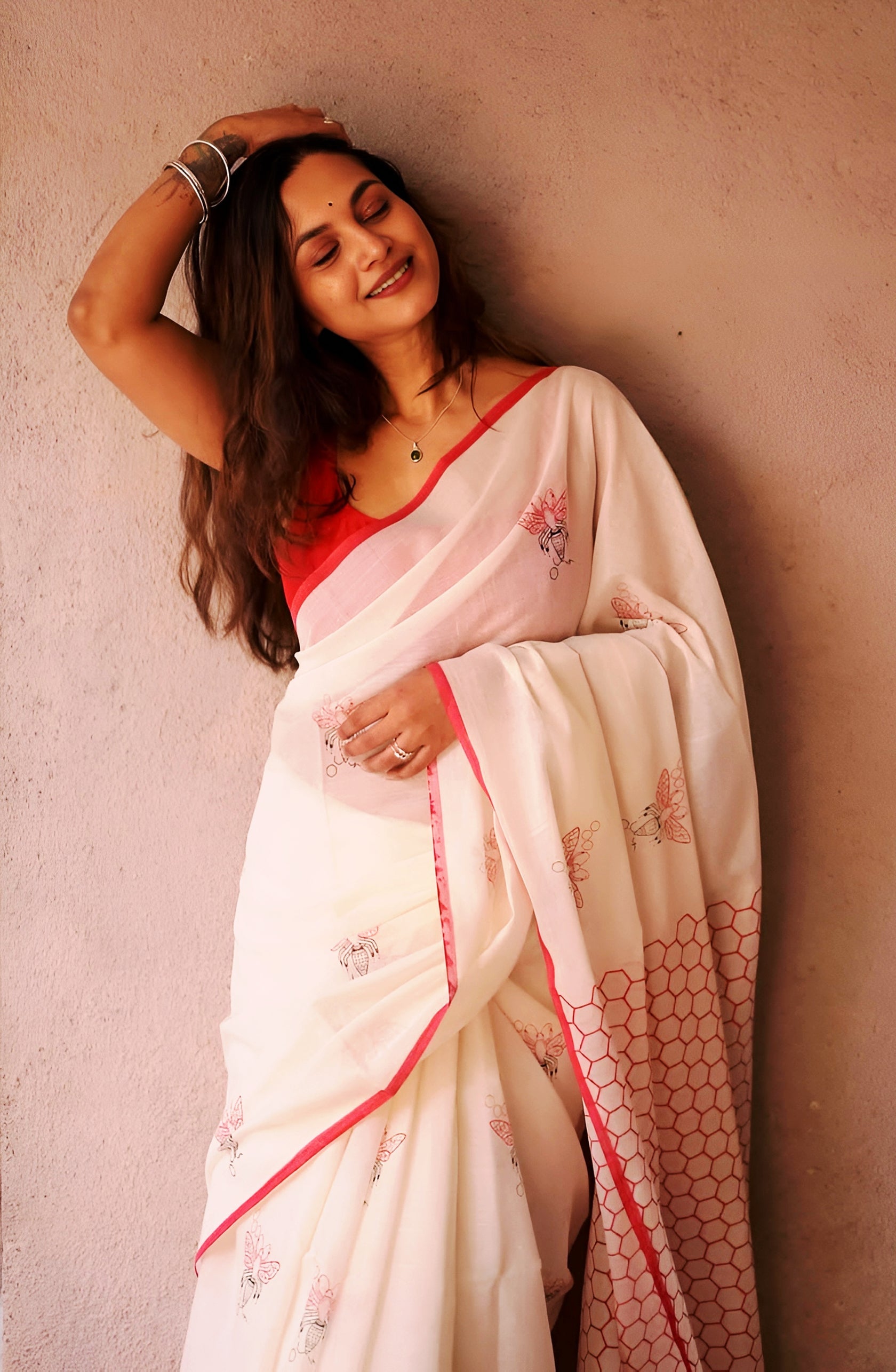 Elegant Cream Linen Cotton Saree with Minimal Floral Print & Red Contrast Border