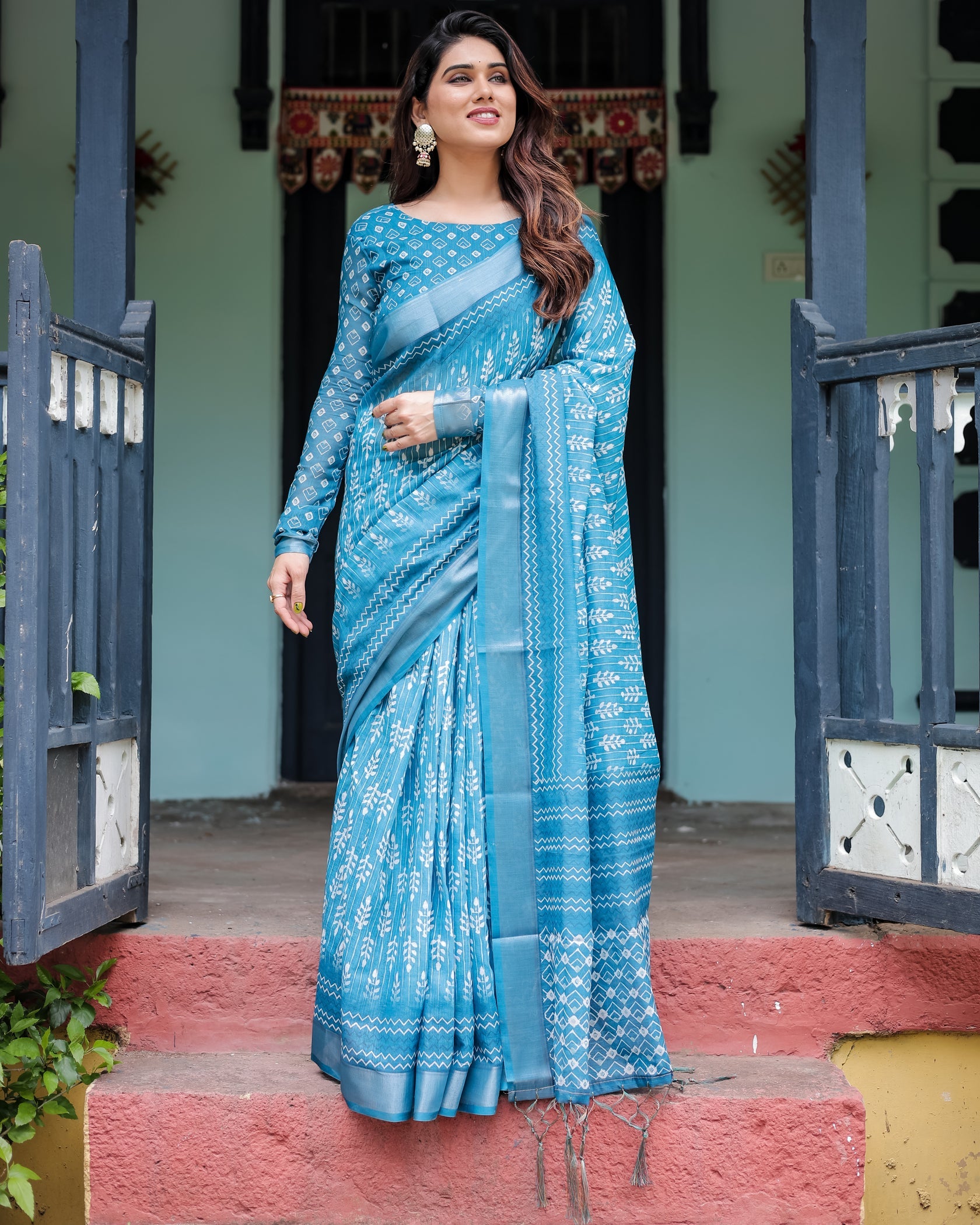 Elegant Sky Blue Printed Cotton Saree with Traditional Border Design