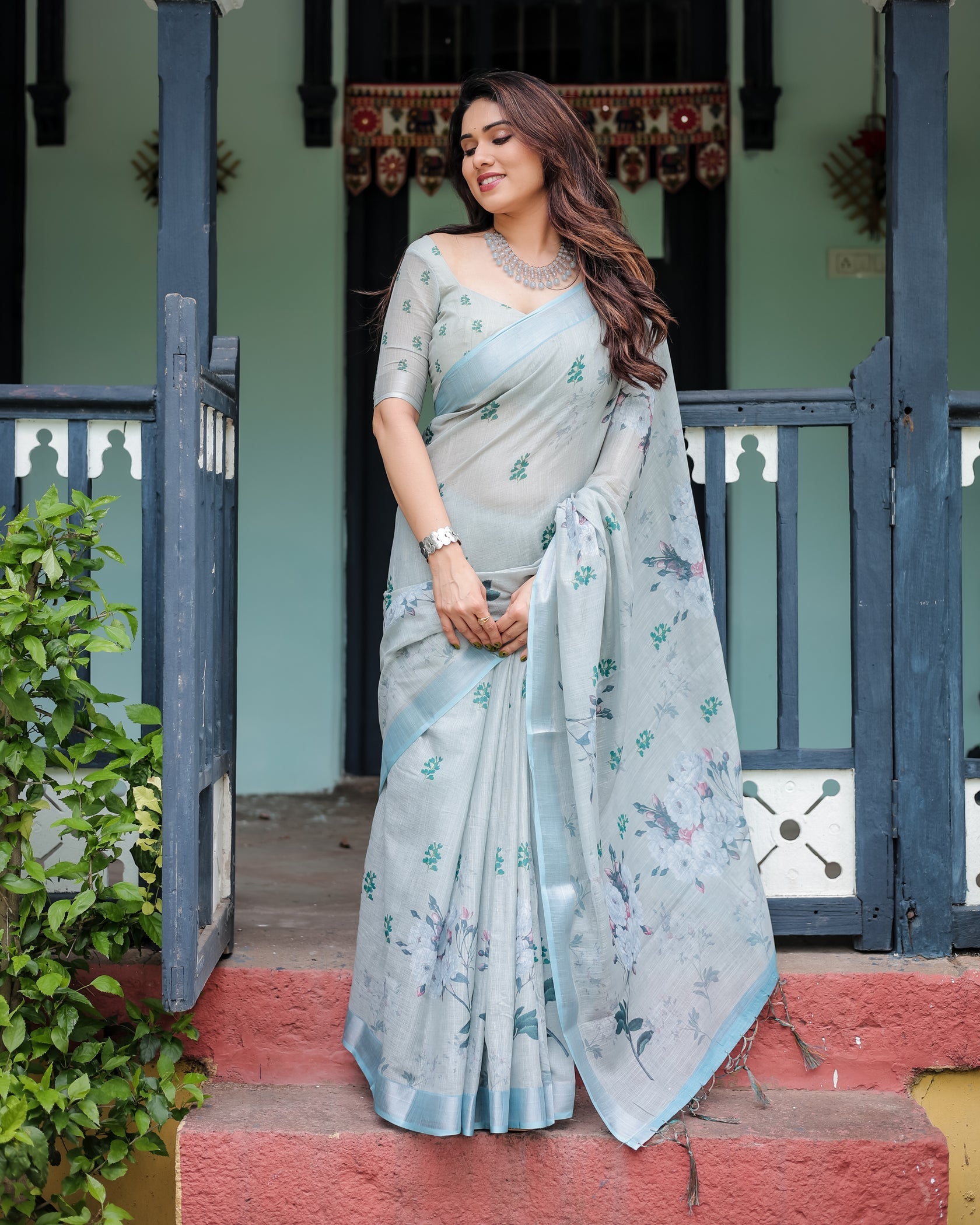 Elegant Mint Green Linen Cotton Saree with Soft Floral Print & Pastel Border