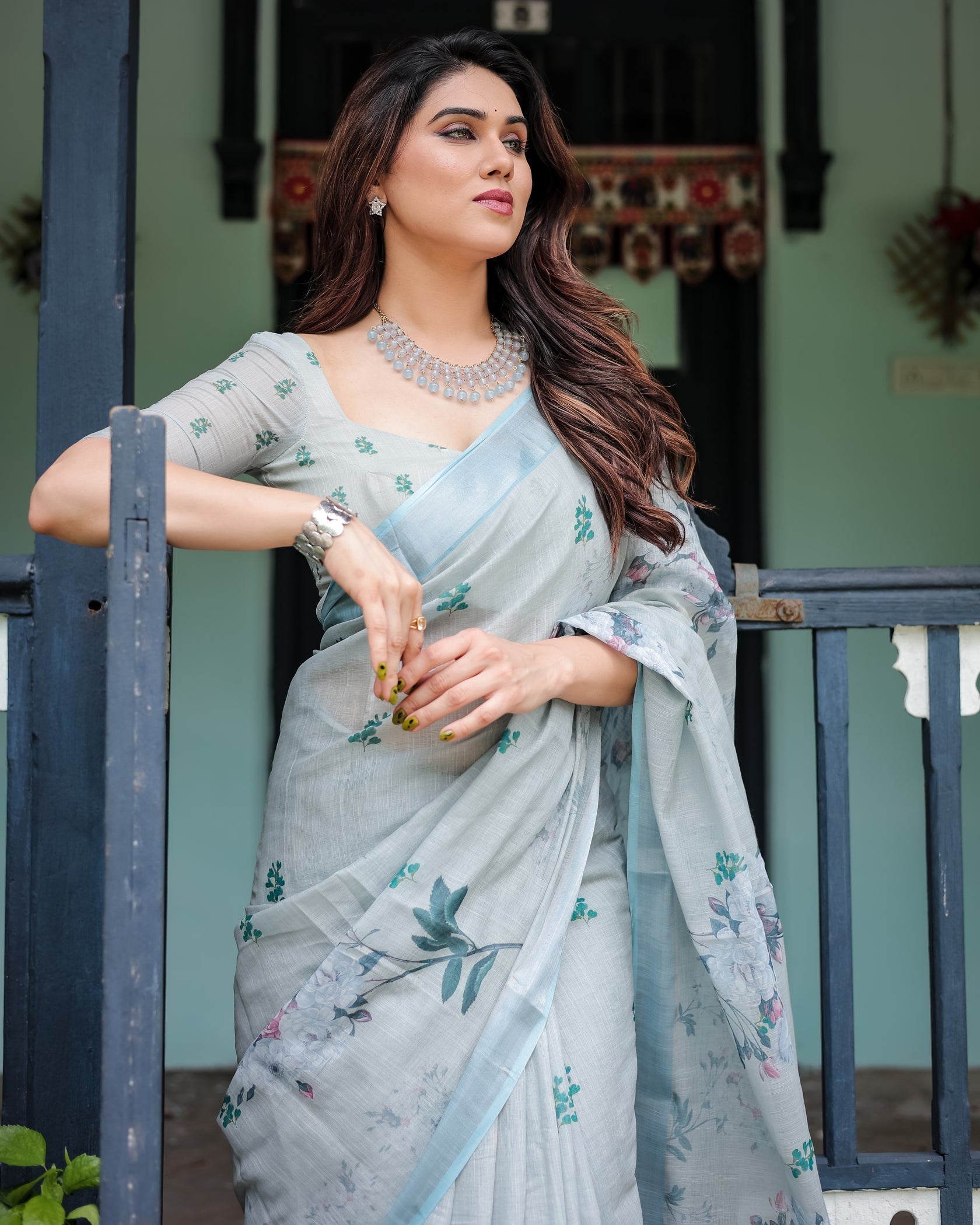Elegant Mint Green Linen Cotton Saree with Soft Floral Print & Pastel Border