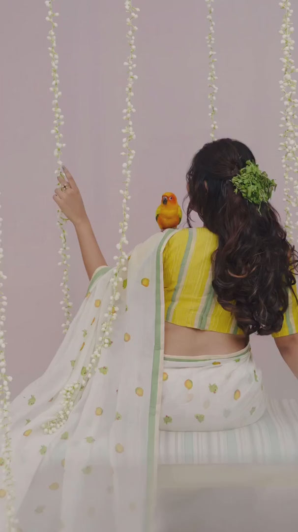 Elegant Off-White Linen Cotton Saree with Parrot Motif & Pastel Green Border